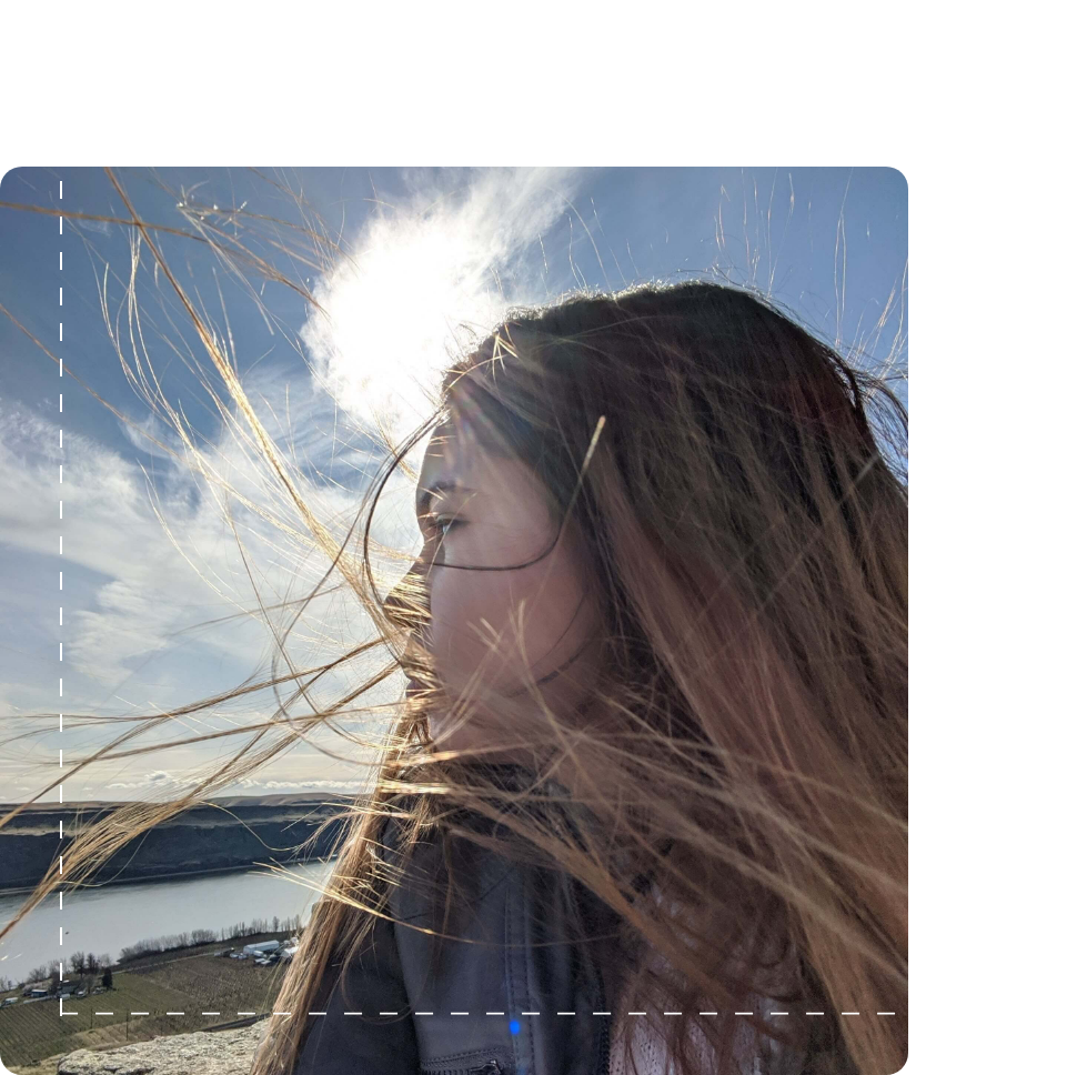 Juanita Samborski looking over shoulder at the river.